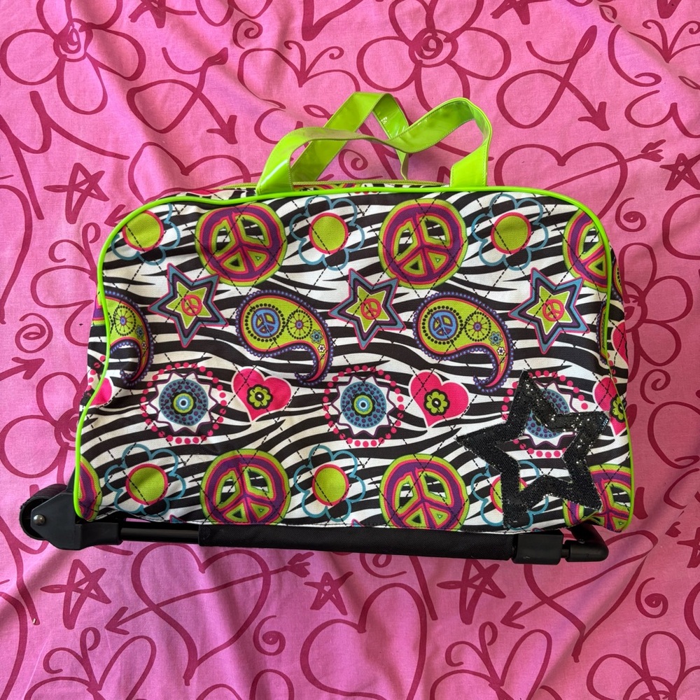 2000s zebra print rolling duffel